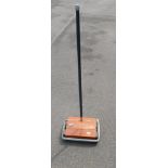 A Prestige Eubank M1300 manual carpet sweeper.