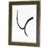 A modern wall art picture, with abstract horn sculpture in central frame, with mounted cream support