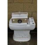 A white toilet and cistern.