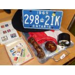 Stamps and American souvenir items, to include an Ontario car number plate, cowboy hat, Canadian fla