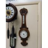 A Victorian oak cased aneroid barometer, 63cm high, 19cm diameter.