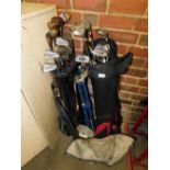 Two bags of various golf clubs, to include irons by Goudie, four vintage Goudie drivers, to include