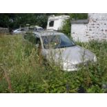 A group of five scrap vehicles. Peugeot 207 SW, registration KW07 PXX, Mondeo LX Estate, registrati