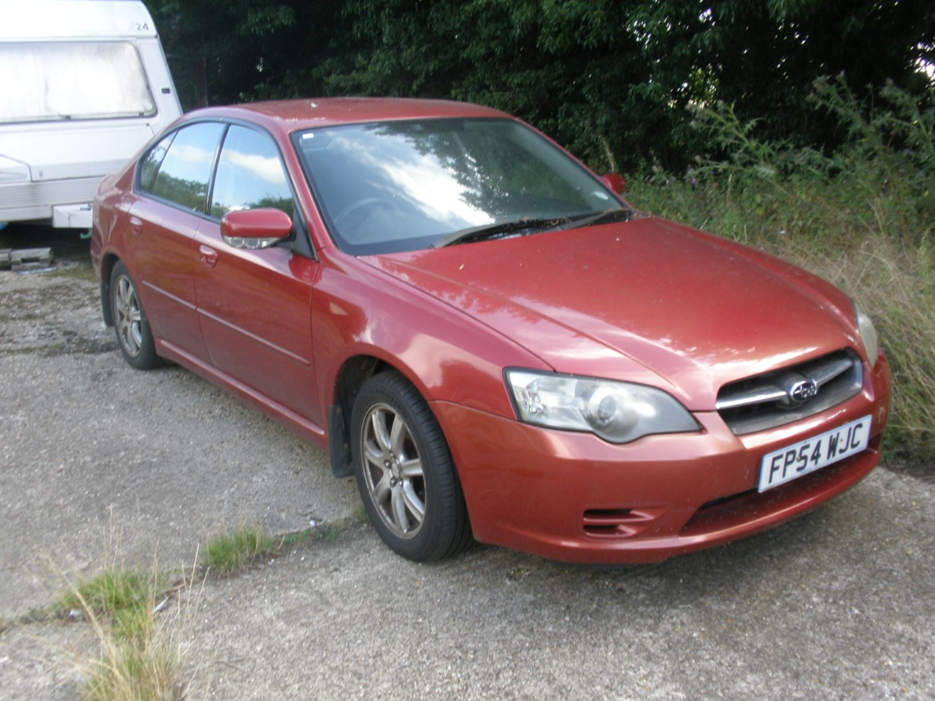 A Subaru Legacy, registration FP54 WJC, 62,609 miles, vehicle starts and has been run around the yar