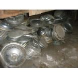 A large quantity of metal hub caps and wheel trims for classic cars, to includ Mercedes, Trimuph, Wo