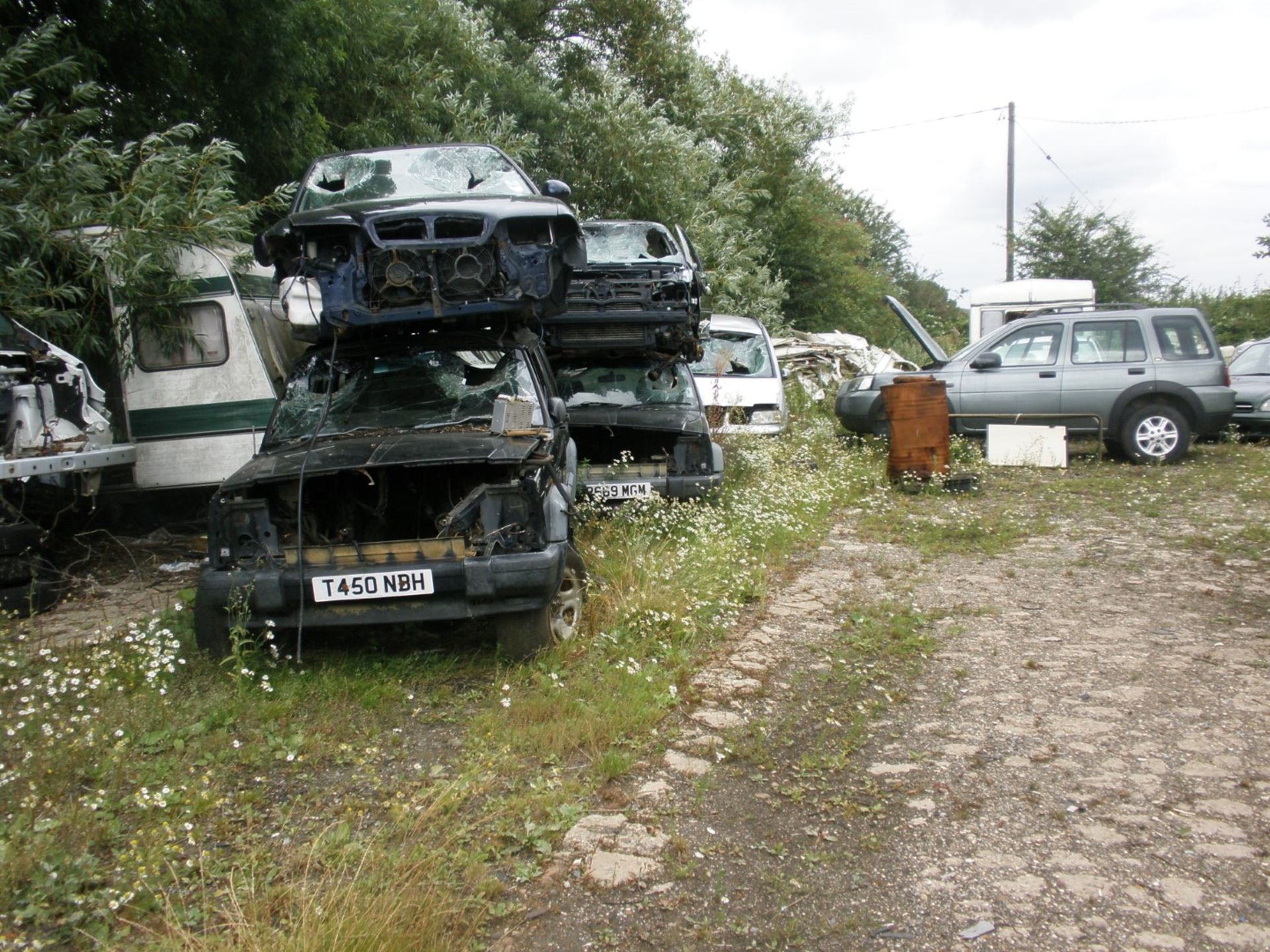 The Residual Scrap Vehicles on site together with other scrap hidden in the undergrowth. To include - Image 7 of 10