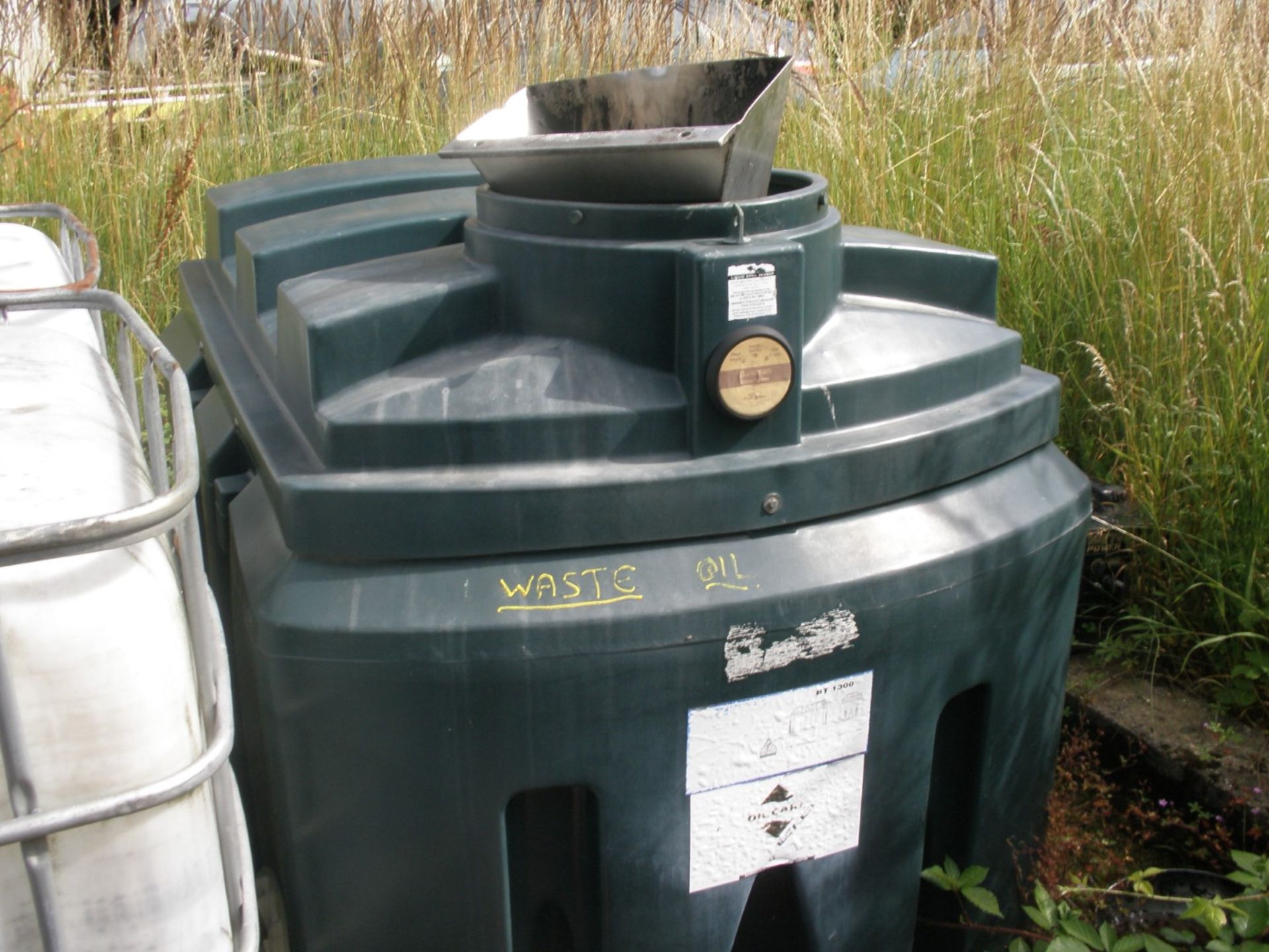 Two plastic oil tanks.