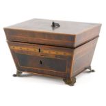An early 19thC mahogany and parquetry jewellery box, of sarcophagus form, the hinged top with a cros