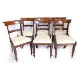 A set of six William IV mahogany dining chairs, each with a shaped bar back and reeded uprights, a d