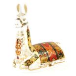 A Royal Crown Derby porcelain paperweight of a llama, for The Royal Crown Derby Collectors Guild, wi
