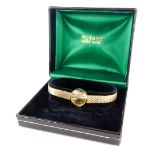 A 9ct gold Rotary ladies wristwatch, with small circular dial, on a bark effect articulated bracelet