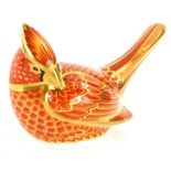 A Royal Crown Derby porcelain paperweight of an American Cardinal, with gold coloured stopper, boxed