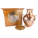 A group of copper and brassware, to include a copper vase previously part of a tea urn, with twist d