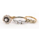 Three dress rings, to include a 9ct gold cluster ring, set with blue and white paste stones, ring si