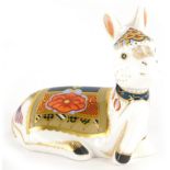 A Royal Crown Derby porcelain paperweight of a donkey foal, with gold coloured stopper, 9cm high, bo
