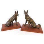 A pair of gilt spelter of Alsatians or wolves, each on a mahogany plinth, 16cm high.