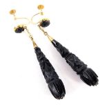 A pair of Victorian black agate drop earrings, the rosette top with chain drop.