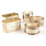 A collection of silver and silver plated napkin rings, to include a pair of George V silver napkin r