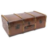 A canvas and wooden bound trunk with leather handle, 92cm wide.