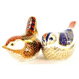 Two Royal Crown Derby porcelain bird paperweights, a Derby wren with gold coloured stopper, and gold