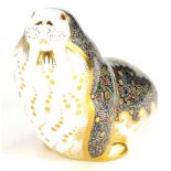 A Royal Crown Derby porcelain paperweight of a Russian walrus, with gold coloured stopper, 11cm high