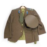 A Russian naval officers uniform, comprising cap, jacket and shirt.