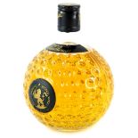 A bottle of Old St Andrews Scotch Whisky Premium blended Clubhouse, in golf ball shaped bottle.