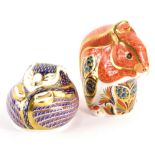 Two Royal Crown Derby porcelain paperweights, a squirrel with silver coloured stopper, 9cm high, and