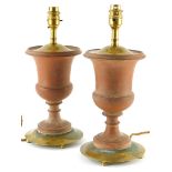 A pair of 20thC terracotta and gilt metal urn shaped table lamps, 34cm high overall.