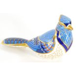 A Royal Crown Derby porcelain paperweight of a Blue Jay, with silver coloured stopper, 16cm long, bo