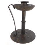 A late 19thC German Jugendstil bronzed chamber candlestick, with hammered decoration, the base indis