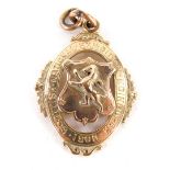 A Scottish National Exhibition 1908 shield pendant, with central shield and applied figure of eight