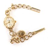 A Sovereign 9ct gold cased ladies wristwatch, with small oval watch head and applied oval locket pen