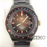 A gentleman's Seiko Sports 5 Line wristwatch, having sunburst grey scale dial with day and date aper