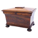 A William IV figured mahogany sarcophagus shaped cellarette, the domed top with a moulded edge, with