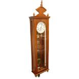 A Vienna wall clock, in a mahogany veneered case with enamel type dial, 128cm high overall.