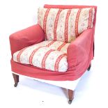 A late Victorian Howard & Sons mahogany armchair, with loose covers above calico ticking, maker's st