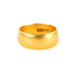 A 22ct gold thick wedding band, ring size L, 6.2g.