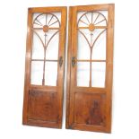 A pair of continental mahogany wardrobe doors, each with glazed central section above a panel, 152cm