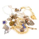 A group of costume jewellery, comprising silver and enamelled bow brooch, faux pearl necklaces, bar