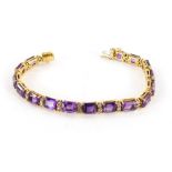 An amethyst and diamond set bracelet, with rectangular cut amethyst stones, broken by arrangement of