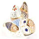 Two Royal Crown Derby paperweights, an owl with silver coloured stopper, 13cm long, and a hen with s
