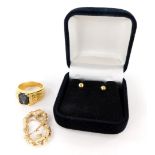 Three items of jewellery, to include a pair of 9ct gold hoop drop earrings, a pair of 9ct gold studs