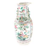 A Chinese Cantonese baluster vase, heavily decorated with dragons, birds and flowers, 46cm high (AF)