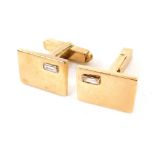 A pair of 9ct gold gentleman's cuff links, each set with a white stone, 12.9g all in. (boxed)