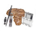 A group of African related items, to include a wooden map of Africa with carved animal figures, 71cm