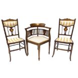 A suite of three chairs, each decorated with marquetry and simulated stringing, comprising a corner