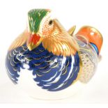 A Royal Crown Derby porcelain paperweight of a Mandarin duck, with silver coloured stopper, boxed.