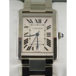 A gentleman's Cartier stainless steel tank wristwatch, having rectangular dial with internal minute