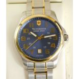 A gentleman's Victorinox bi-metallic wristwatch, having blue sunburst dial with applied gilt markers